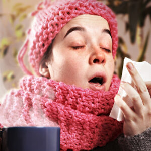 sneezing ill young woman