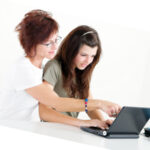 mom and teen on computer