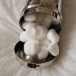 canister-with-cotton-balls